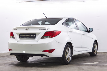 Продажа Hyundai Solaris I 1.6 AT (123 л.с.) 2014 Белый в Автодом
