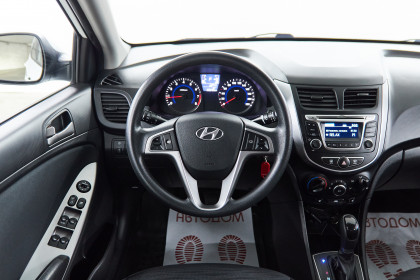 Продажа Hyundai Solaris I 1.6 AT (123 л.с.) 2014 Белый в Автодом